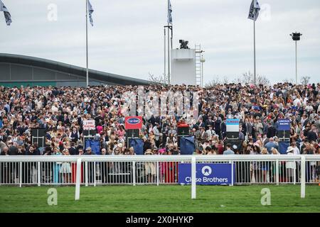 Racegoers enjoy the atmosphere during the The Randox Grand National 2024 Ladies Day at Aintree Racecourse, Liverpool, United Kingdom, 12th April 2024  (Photo by Mark Cosgrove/News Images) Stock Photo