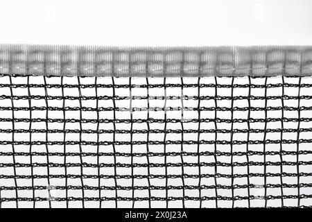 Black sports net with white border for racket and ball games isolated on white background. Stock Photo