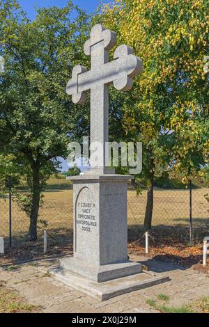 Subotica, Serbia - August 01, 2022: Large Marble Stone Cross at Road to Holy Mother of God Monastery in Vojvodina. Stock Photo