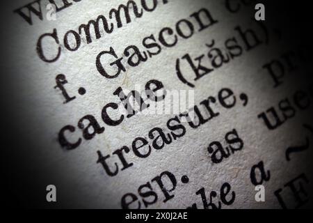 Word cache on dictionary page, macro close-up Stock Photo