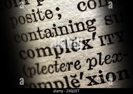 Word complexity on dictionary page, macro close-up Stock Photo