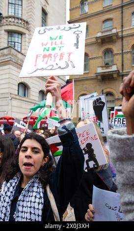 Demonstrators gather near a Palestinian flag during a protest in Lyon ...