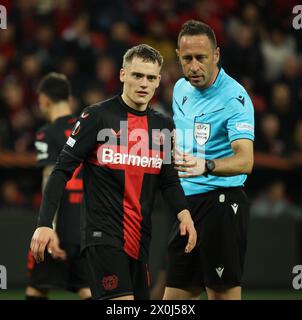 Leverkusen, Germany. 11th Apr, 2024. Leverkusen, Deutschland. 11th Apr, 2024. Florian Wirtz (Bayer), referee Artur Dias, UEFA Europa League, quarter-final, first leg, Bayer 04 Leverkusen vs West Ham United, Leverkusen, Germany, 11.04.2024. Credit: Juergen Schwarz/Alamy Live News Stock Photo