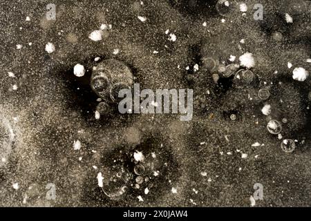 Air bubbles trapped in the ice, close-up, Germany Stock Photo