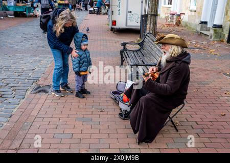 A Child Nervously Watches A Pirate Street Entertainer In The High 