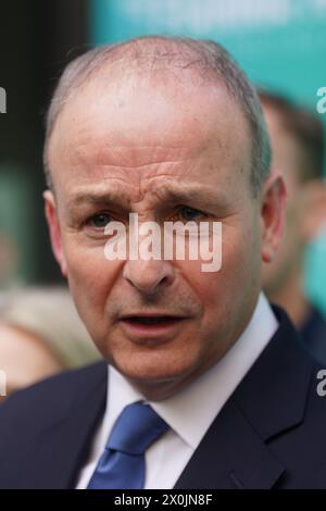 Tanaiste Micheal Martin speaks to the media ahead of the Fianna Fail Ard Fheis, at the Dublin Royal Convention Centre. Picture date: Friday April 12, 2024. Stock Photo