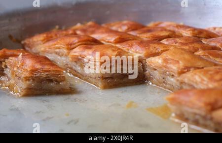 Baklava, traditional Turkish phyllo dessert. Hommade walnut baklava is an indispensable treat of holy feast. Stock Photo