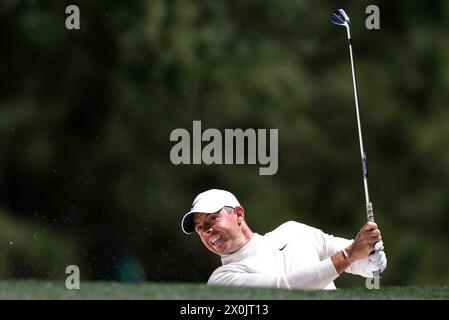 Augusta, United States. 12th Apr, 2024. Northern Ireland's Rory McIlroy hits out of bunker on the first hole in the second round of the Masters Tournament at Augusta National Golf Club in Augusta, Georgia on Friday, April 12, 2024. Photo by John Angelillo/UPI Credit: UPI/Alamy Live News Stock Photo