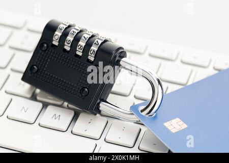 Security lock closed on credit card on computer keyboard . Financial data protection concept Stock Photo