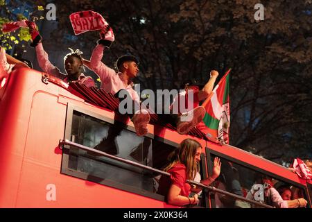 Bilbao, Biscay, Spain - April 11th 2024 - Athletic Club de Bilbao fans celebrate the 25th Copa del Rey title with the barge Stock Photo