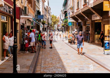 Main Street, Calle Real, is the main arterial street in the British overseas territory of Gibraltar, was established in the 14th century. Main Street Stock Photo