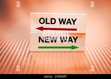 New way vs old way. Concept, New opportunities, direction of development, Written on wooden blocks, Fiery background Stock Photo