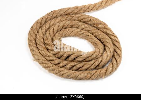 Closeup of a rolled piece of rope isolated on white background Stock Photo