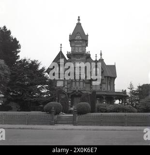 1950s, historical, the distinctive Carson mansion, a Victorian house built in the gothic style of architectural style, in Old Town, Eureka, California, USA,. It was constructed in 1885 as the family home of Wiliam Carson, an American redwood timber magnet. In 1950, it was brought by local businessmen and became a private club, The Ingomar Club, Members Only, as per the sign outside the entrance. Stock Photo