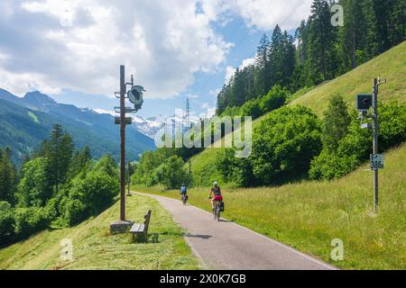 Gossensass (Colle Isarco), bicycle way Radroute 1 'Brenner-Salurn' on former Brenner Railway line, cyclist, in Wipptal Valley in South Tyrol, Trentino-South Tyrol, Italy Stock Photo