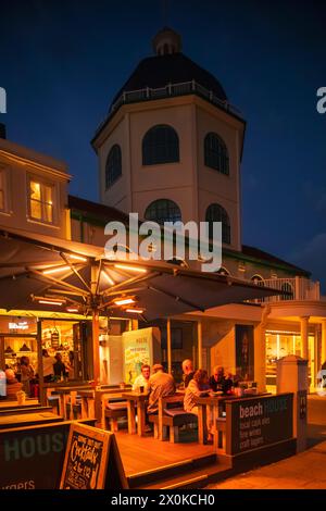 England, West Sussex, Worthing, Marine Parade, The Dome Cinema and Bars at Night Stock Photo