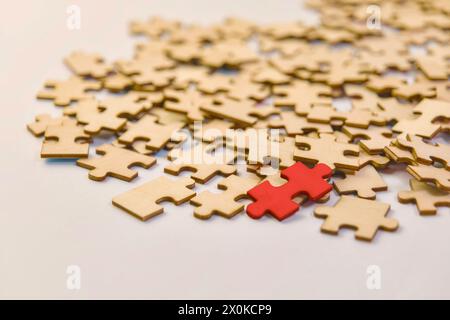 A conceptual image showcasing a puzzle nearing completion, with one unique piece remaining to solve the challenge Stock Photo