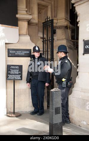 Two Policemen at the Entrance to Black Rod's Garden, Houses of Parliament, Palace of Westminster, City of Westminster, London, UK Stock Photo