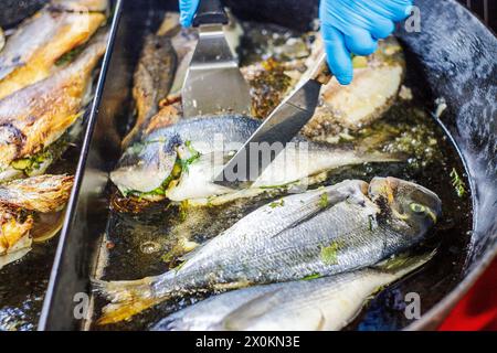 Sea bream in the frying pan Stock Photo