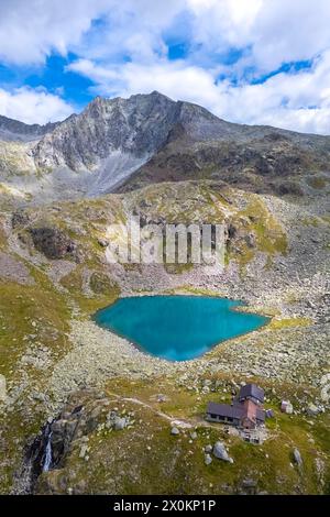 View of the Franco Tonolini refuge and Lake Rotondo in the beautiful Val Miller. Sonico, Val Camonica, Brescia district, Lombardy, Italy. Stock Photo