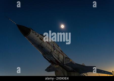 CF-101 Voodoo jetfighter gate guardian viewed during total solar eclipse totality from Miramichi, New Brunswick, Canada, on April 8, 2024. Stock Photo