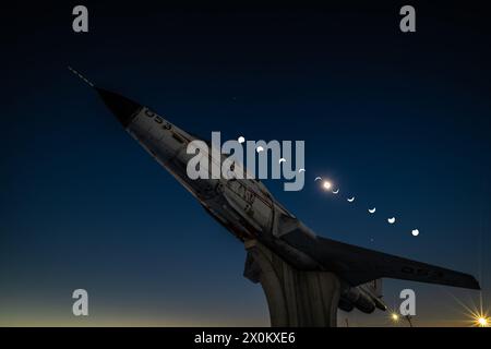 CF-101 Voodoo jetfighter gate guardian under composite image of total solar eclipse viewed from Miramichi, New Brunswick, Canada, on April 8, 2024. Stock Photo