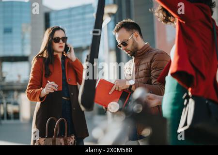 Young entrepreneurs strategizing for business growth in urban setting Stock Photo