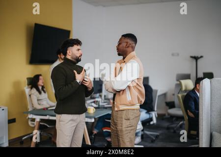 Diverse business professionals collaborating in a creative office, analyzing statistics and discussing reports for financial growth and profit. Stock Photo