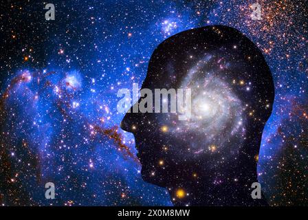 Cosmic mind. Conceptual illustration of a galaxy in a silhouetted human head, representing curiosity of the universe. Stock Photo
