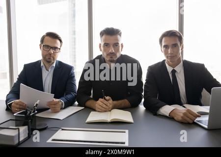 Portrait of three young 35s HR managers interviewing applicants Stock Photo