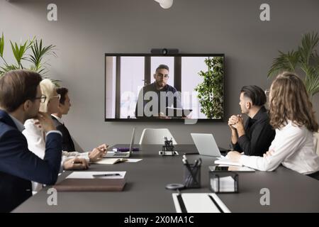 Arabic businessman speaker lead videoconference for staff using modern application Stock Photo