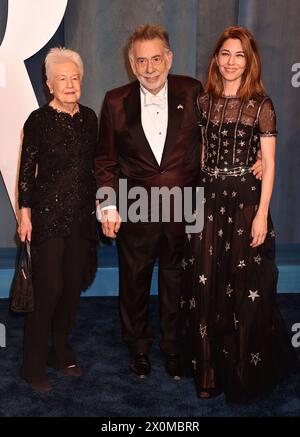 **FILE PHOTO** Eleanor Coppola Has Passed Away. BEVERLY HILLS, CA - MARCH 27: (L-R) Eleanor Coppola, Francis Ford Coppola and Sofia Coppola attend the 2022 Vanity Fair Oscar Party hosted by Radhika Jones at Wallis Annenberg Center for the Performing Arts on March 27, 2022 in Beverly Hills, California. Credit: Jeffrey Mayer/JTMPhotos/MediaPunch Stock Photo