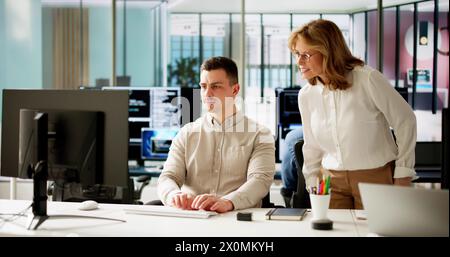Business People Training On Computer. Young Woman In Office Stock Photo