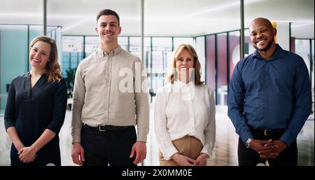 Happy Group Of Business People Standing In Office Stock Photo
