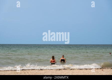 Progreso, Mexico. 22nd Mar, 2024. Tourists and locals enjoy a spring day at Progreso Beach, a more tranquil and laid-back atmosphere compared to the bustling resort city of Cancun. (Photo by Shawn Goldberg/SOPA Images/Sipa USA) Credit: Sipa USA/Ģ����ý Live News Stock Photo