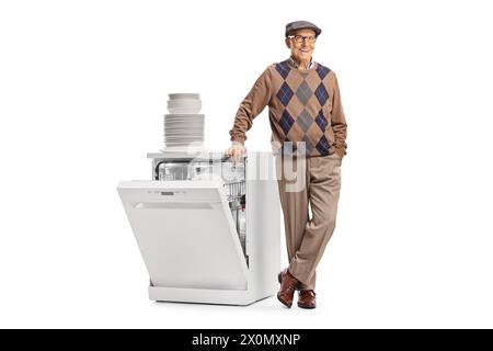 Elderly man with a dishwasher and a pile of clean white plates isolated on white background Stock Photo