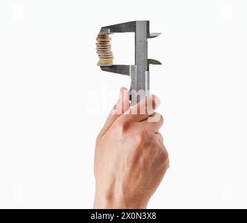 Closeup shot of a man holding  clamp and stack of coins isolated on white background. Stock Photo