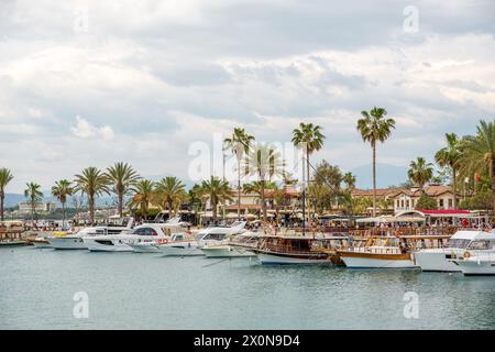 Side, Manavgat, Turkey – April 9, 2024: Sightseeing boats and town square in Side, one of Turkey's unique and historical holiday destinations Stock Photo