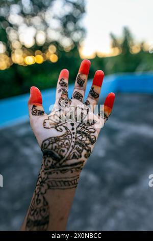 Picture of a child's hand decorated with henna tattoo, also known as mehendi hand. Stock Photo