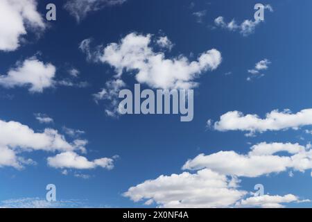 Cloud clusters scattered in blue sky With copyspace for text. Stock Photo