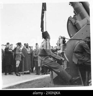 KING IBN SAUD SEES EGYPT'S MILITARY MIGHT - The two Kings show keen interest in a demonstration of heavy ack-ack artillery Stock Photo