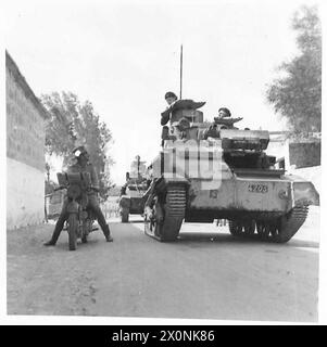 PHOTOGRAPHS TAKEN IN CYPRUS - Light tanks seen in a village on the ...