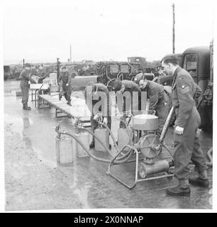 PHOTOGRAPHS TAKEN AT A MOBILE PETROL FILLING CENTRE R.A.S.C. - Removing the nozzle from filled cans. Photographic negative , British Army Stock Photo