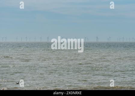 Wind farm off the coast of Brighton on a hazy day. April 2024. Stock Photo