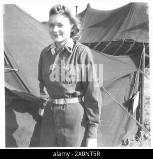 FIFTH ARMY : ANZIO BRIDGEHEADANZIO PERSONALITIES - 2/Lieut. M.J. Holcombe of Dacusville, South Carolina, is a blond American Red Cross nurse who has now had 13 months foreign service. She dislikes the bridgehead, the tented Field Hospital where she works had been both bombed and shelled with six nurses being killed, but is thrilled by the fact that this is the nearest to the front line that nurses have been allowed to work. Photographic negative , British Army Stock Photo