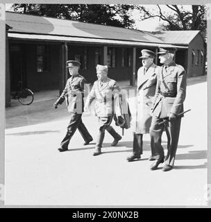 An Italian prisoner of war is escorted by British Army personnel ...