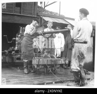 AT A PROOF RANGE - Removing the barrel of a Bofors gun after proofing. Photographic negative , British Army Stock Photo