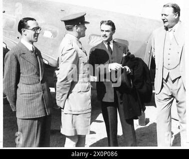 NEW MINISTER OF STATE ARRIVES IN MIDDLE EAST - Mr. Casey is met by General Auchinleck, the British Ambassador, and Sir Walter Monckton. Photographic negative , British Army Stock Photo