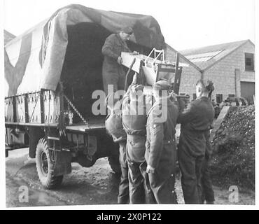 PHOTOGRAPHS TAKEN AT A MOBILE PETROL FILLING CENTRE R.A.S.C. - Unloading the Mobile Petrol Filling equipment from a 3-ton lorry. Photographic negative , British Army Stock Photo