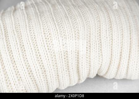 Close-up of the texture and pattern of a white warm knitted sweater Stock Photo